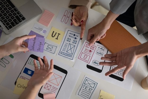 Top view image of a UX UI graphic designer team voting a perfect prototype in the meeting